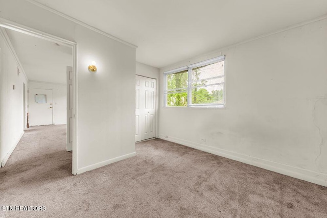 255 N Purdue Ave, Oak Ridge, TN 37830 - unfurnished bedroom featuring carpet flooring, baseboards, crown molding, and a closet