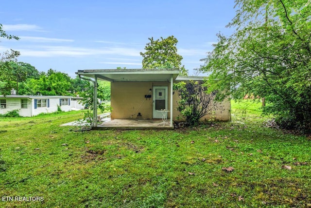 255 N Purdue Ave, Oak Ridge, TN 37830 - back of property featuring a yard, a patio area, and concrete block siding