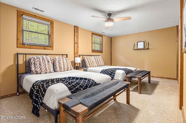 1293 Laurel Lick Rd, Sevierville, TN 37862 - bedroom featuring carpet floors, a textured ceiling, baseboards, and a ceiling fan