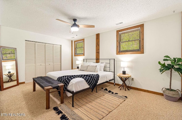 1293 Laurel Lick Rd, Sevierville, TN 37862 - bedroom with light carpet, a closet, baseboards, ceiling fan, and a textured ceiling