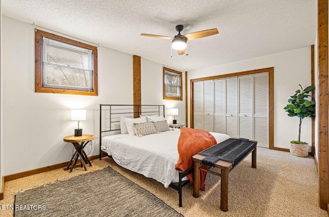 1293 Laurel Lick Rd, Sevierville, TN 37862 - bedroom featuring a closet, carpet floors, a textured ceiling, baseboards, and a ceiling fan