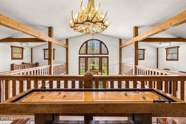 1293 Laurel Lick Rd, Sevierville, TN 37862 - detailed view of beam ceiling, a chandelier, and a textured ceiling