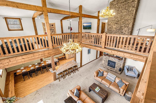 1293 Laurel Lick Rd, Sevierville, TN 37862 - living room with a chandelier, carpet, and vaulted ceiling