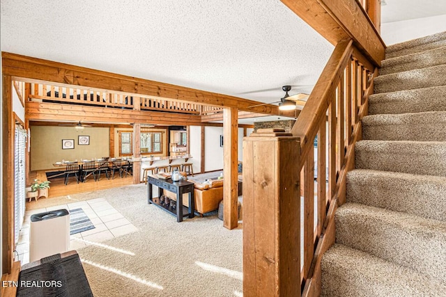 1293 Laurel Lick Rd, Sevierville, TN 37862 - stairs with a ceiling fan and a textured ceiling