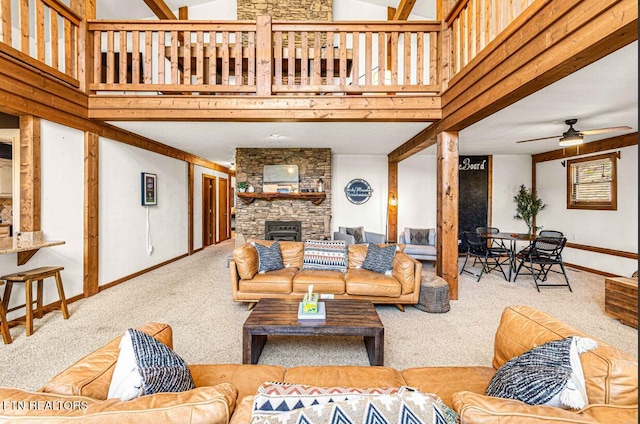 1293 Laurel Lick Rd, Sevierville, TN 37862 - carpeted living room with a high ceiling, ceiling fan, a fireplace, and baseboards