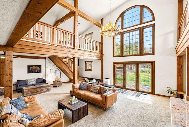 1293 Laurel Lick Rd, Sevierville, TN 37862 - carpeted living room with a towering ceiling, a chandelier, stairway, and beam ceiling