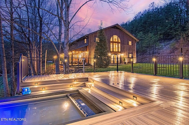1293 Laurel Lick Rd, Sevierville, TN 37862 - back of property at dusk with a wooden deck