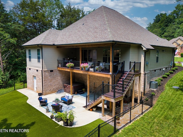101 Dudala Way, Loudon, TN 37774 - back of property with a hot tub, a patio area, stairway, a fenced backyard, and roof with shingles