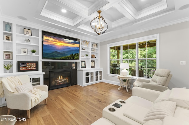 101 Dudala Way, Loudon, TN 37774 - living area with crown molding, wood finished floors, a glass covered fireplace, built in shelves, and a chandelier