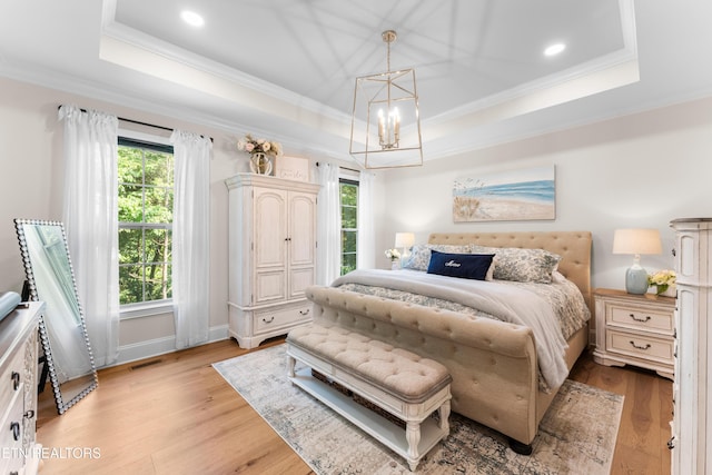 101 Dudala Way, Loudon, TN 37774 - bedroom featuring a raised ceiling, a chandelier, ornamental molding, light wood finished floors, and access to outside