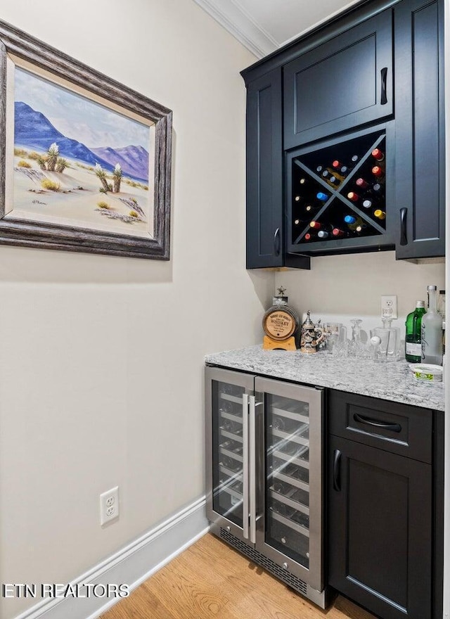 101 Dudala Way, Loudon, TN 37774 - indoor dry bar with beverage cooler, light wood-type flooring, and crown molding