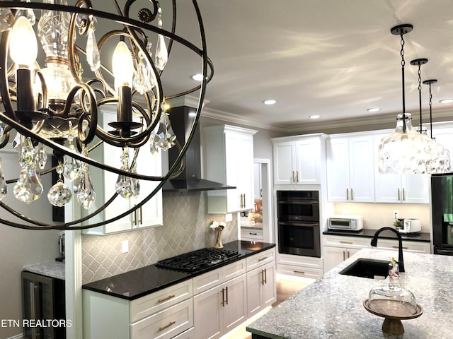 101 Dudala Way, Loudon, TN 37774 - kitchen with black gas stovetop, double oven, wall chimney exhaust hood, decorative backsplash, and ornamental molding