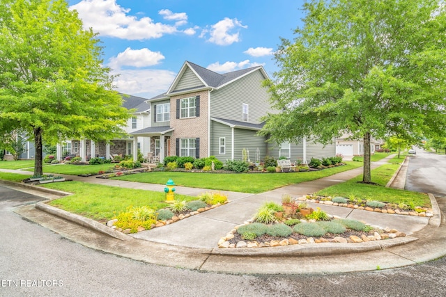 128 Hackberry St, Oak Ridge, TN 37830 - view of front of house with a front yard and brick siding