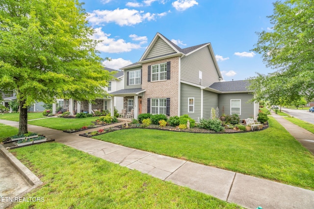 128 Hackberry St, Oak Ridge, TN 37830 - traditional home featuring brick siding and a front yard