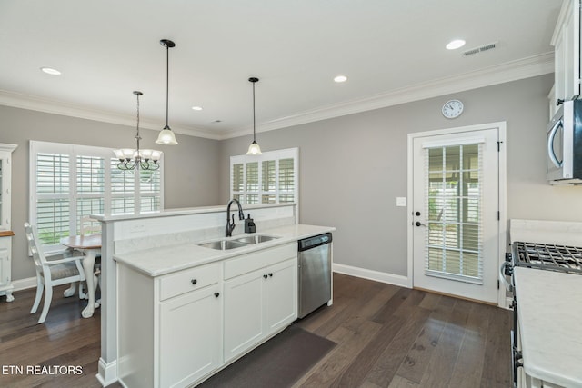 128 Hackberry St, Oak Ridge, TN 37830 - kitchen with appliances with stainless steel finishes, a sink, dark wood-style floors, plenty of natural light, and ornamental molding