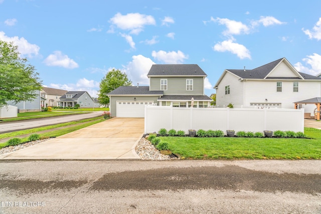 128 Hackberry St, Oak Ridge, TN 37830 - traditional-style home with concrete driveway, a residential view, and a garage