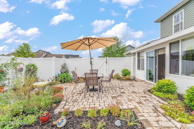 128 Hackberry St, Oak Ridge, TN 37830 - fenced backyard featuring a patio and outdoor dining area