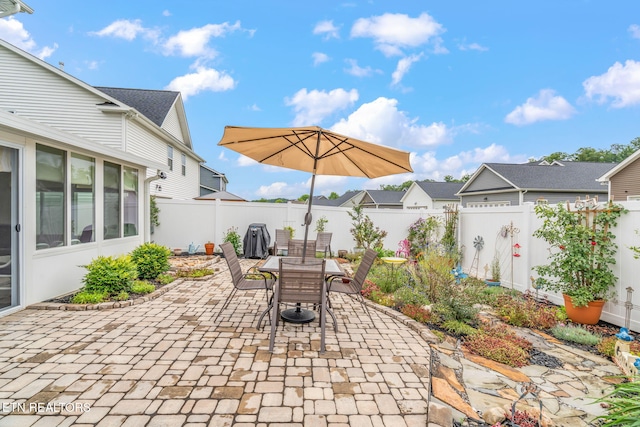 128 Hackberry St, Oak Ridge, TN 37830 - fenced backyard featuring a patio and outdoor dining space