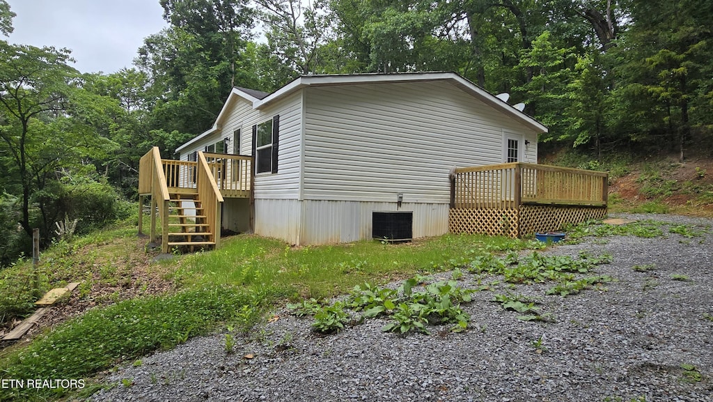 1678 Raven Hill Rd, Tazewell, TN 37879 - view of side of home with a deck, stairs, and central AC
