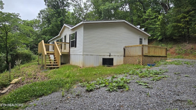1678 Raven Hill Rd, Tazewell, TN 37879 - view of side of home with a deck, stairs, and central AC