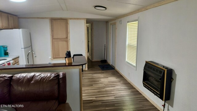 489 Trimmer Ln, Jamestown, TN 38556 - kitchen with heating unit, lofted ceiling, freestanding refrigerator, wood finished floors, and baseboards