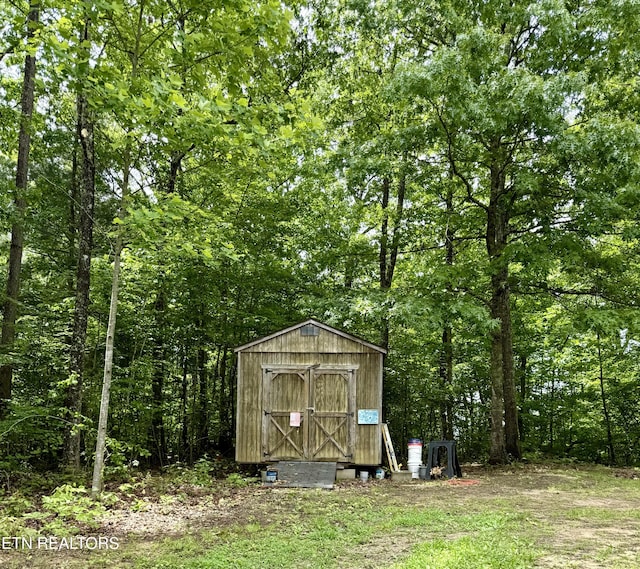 489 Trimmer Ln, Jamestown, TN 38556 - view of shed with a view of trees