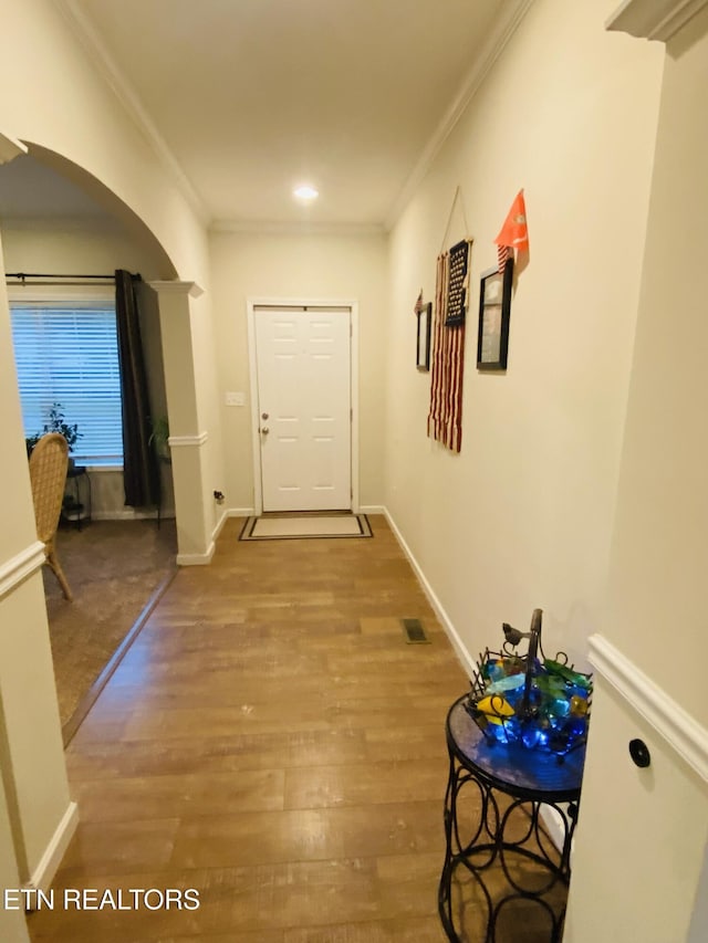 318 Deer Trail Dr, Dandridge, TN 37725 - hall featuring crown molding, wood finished floors, arched walkways, and baseboards