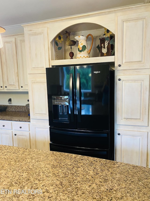 318 Deer Trail Dr, Dandridge, TN 37725 - kitchen view of black refrigerator with ice dispenser and stone counters