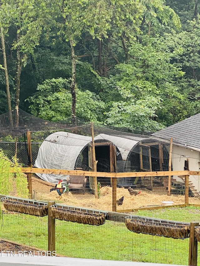318 Deer Trail Dr, Dandridge, TN 37725 - view of yard featuring exterior structure, an outbuilding, and a forest view