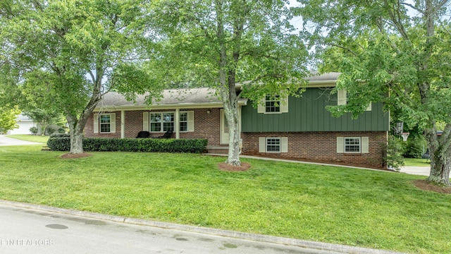 1502 Woodbury Ct, Maryville, TN 37803 - split level home with a front lawn and brick siding