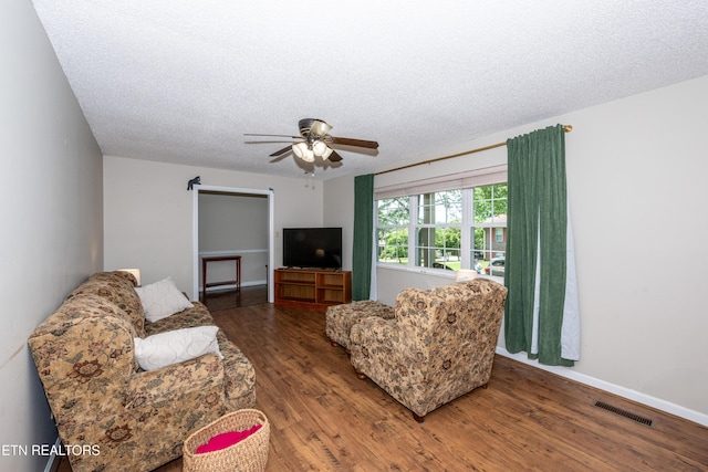 1502 Woodbury Ct, Maryville, TN 37803 - living room with wood finished floors, ceiling fan, a textured ceiling, and baseboards