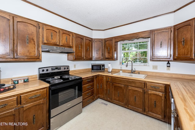 1502 Woodbury Ct, Maryville, TN 37803 - kitchen with stainless steel appliances, under cabinet range hood, a sink, a textured ceiling, and butcher block counters