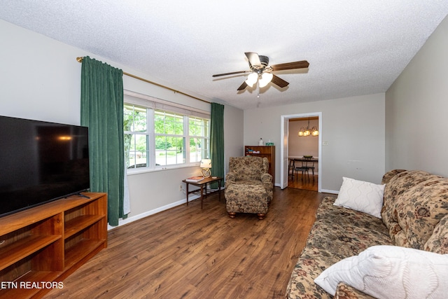1502 Woodbury Ct, Maryville, TN 37803 - living room with ceiling fan, wood finished floors, a textured ceiling, baseboards, and a chandelier