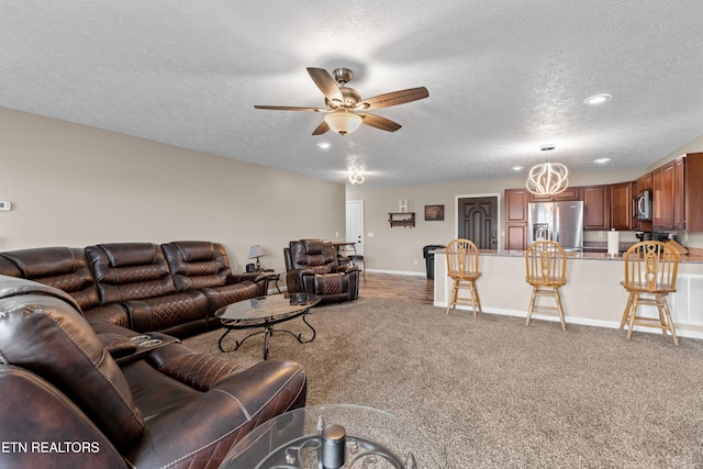 2055 Scott St, Sevierville, TN 37876 - living area with a textured ceiling, a ceiling fan, baseboards, light carpet, and recessed lighting