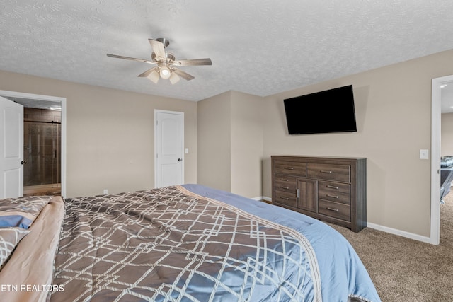 2055 Scott St, Sevierville, TN 37876 - bedroom with carpet, a textured ceiling, ceiling fan, baseboards, and ensuite bathroom