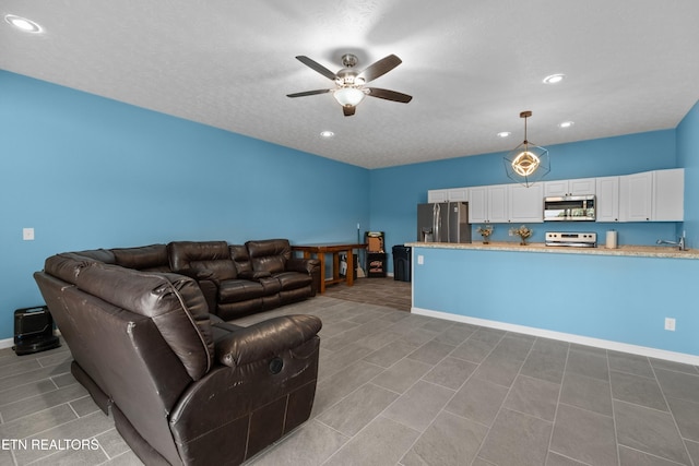 2055 Scott St, Sevierville, TN 37876 - living area with ceiling fan, recessed lighting, and baseboards
