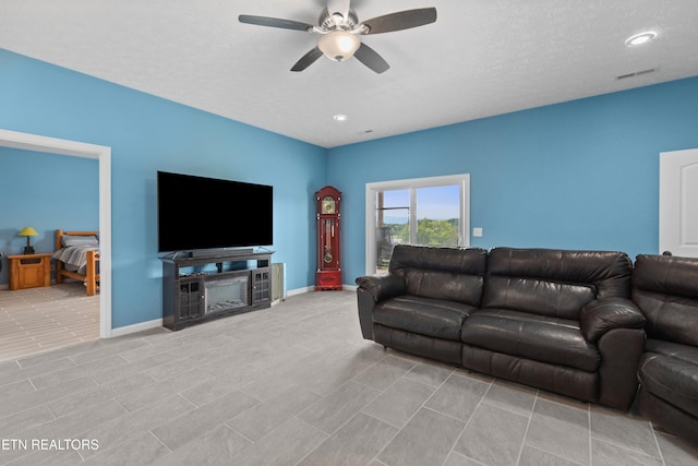 2055 Scott St, Sevierville, TN 37876 - tiled living room with a ceiling fan, baseboards, and recessed lighting