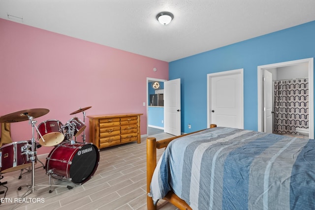 2055 Scott St, Sevierville, TN 37876 - bedroom featuring wood finished floors and a textured ceiling
