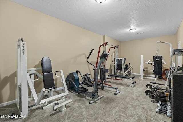 2055 Scott St, Sevierville, TN 37876 - workout room featuring a textured ceiling and baseboards
