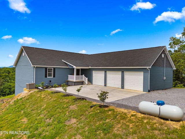 2055 Scott St, Sevierville, TN 37876 - single story home featuring an attached garage, cooling unit, concrete driveway, roof with shingles, and a front yard