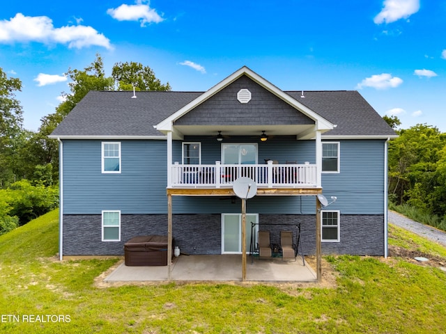 2055 Scott St, Sevierville, TN 37876 - rear view of house with ceiling fan, a patio area, and a lawn