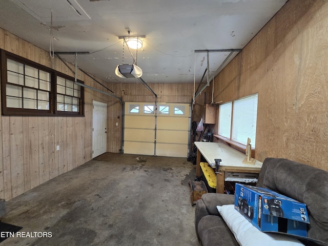 288 Machine Branch Rd, Ewing, VA 24248 - garage with wood walls and a garage door opener