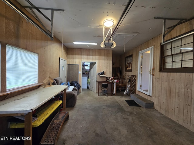 288 Machine Branch Rd, Ewing, VA 24248 - garage featuring wooden walls, a garage door opener, and washer / dryer