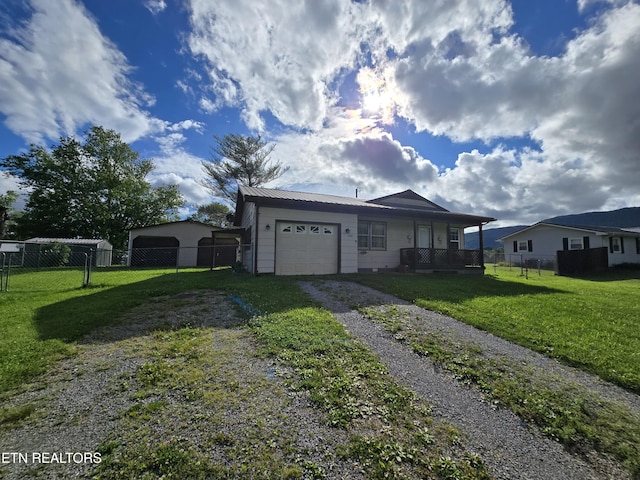 288 Machine Branch Rd, Ewing, VA 24248 - view of front of home featuring driveway, a garage, covered porch, and metal roof