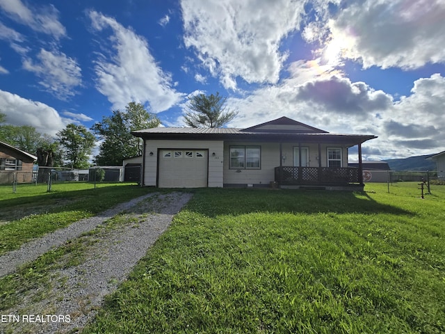 288 Machine Branch Rd, Ewing, VA 24248 - view of front facade with driveway, an attached garage, metal roof, and covered porch
