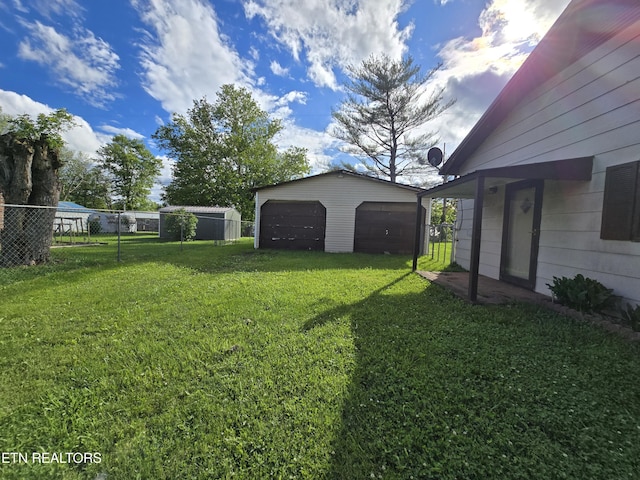 288 Machine Branch Rd, Ewing, VA 24248 - view of yard with a garage and an outbuilding
