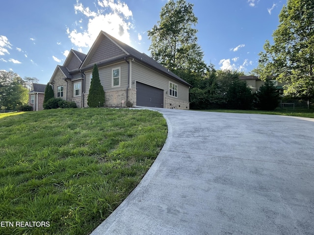 103 Crossroads Blvd, Oak Ridge, TN 37830 - view of home's exterior with concrete driveway, brick siding, a yard, and an attached garage