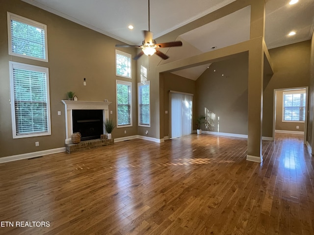 103 Crossroads Blvd, Oak Ridge, TN 37830 - unfurnished living room with a towering ceiling, a ceiling fan, hardwood / wood-style floors, baseboards, and recessed lighting