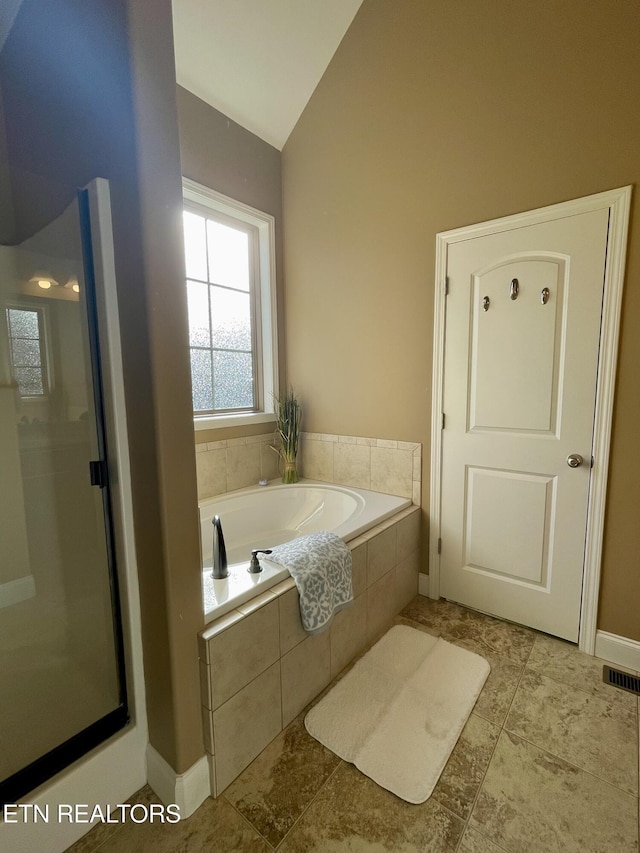 103 Crossroads Blvd, Oak Ridge, TN 37830 - bathroom featuring lofted ceiling, a shower stall, a garden tub, and baseboards
