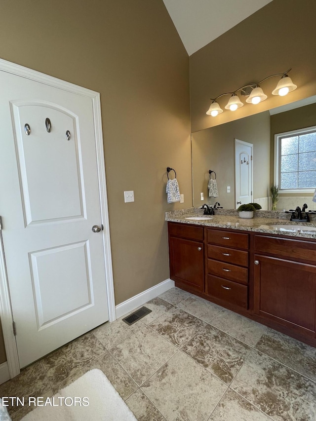 103 Crossroads Blvd, Oak Ridge, TN 37830 - bathroom featuring high vaulted ceiling, double vanity, and baseboards
